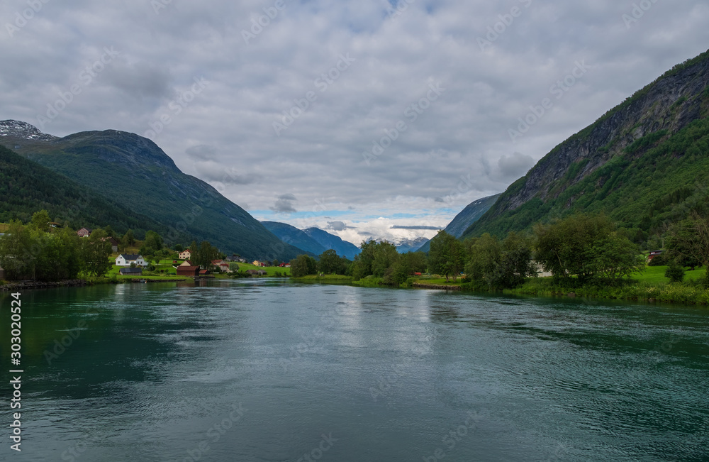 Oldedalen valley - one of the most spectacular areas of natural beauty in Norway. Town Stryn and river Strynselva. July 2019 Oldedalen valley - one of the most spectacular areas of natural beauty in Norway. Town Stryn and river Strynselva. July 2019