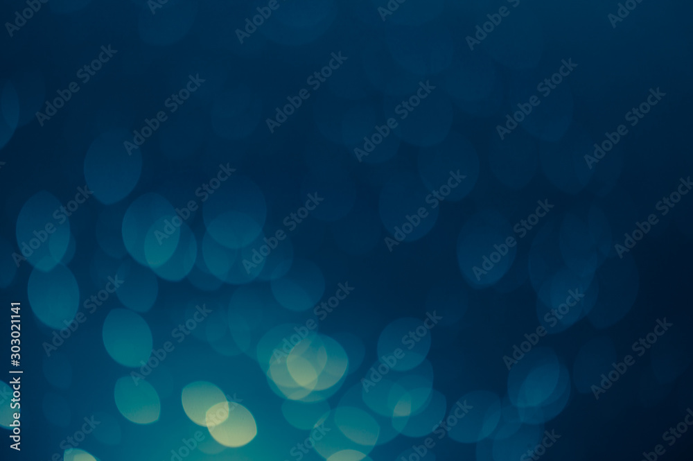 dark blue Festive Christmas Beautiful abstract Background with bokeh lights. Holiday Texture with copy space. Can be used as Wallpaper, filling for a website, defocused dark blue Festive Christmas Beautiful abstract Background with bokeh lights. Holiday Texture with copy space. Can be used as Wallpaper, filling for a website, defocused