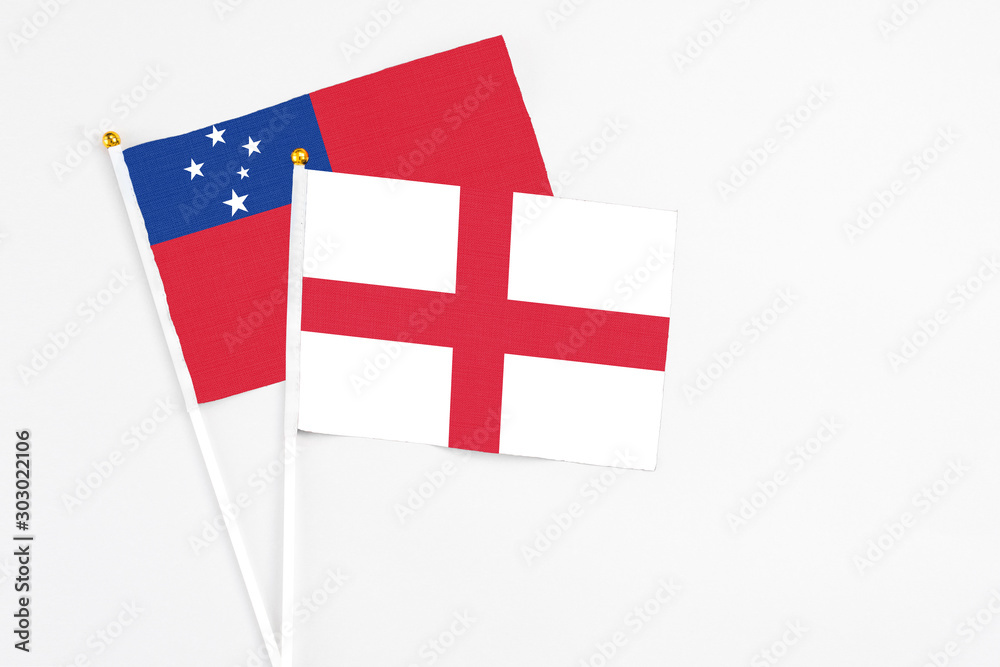 England and Samoa stick flags on white background. High quality fabric, miniature national flag. Peaceful global concept.White floor for copy space.
