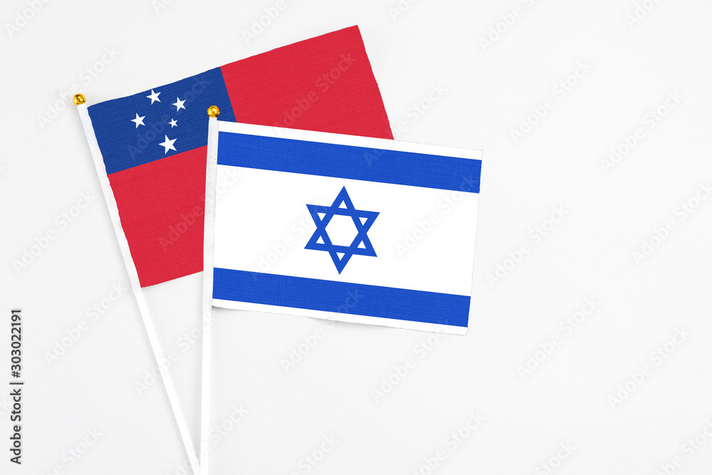 Israel and Samoa stick flags on white background. High quality fabric, miniature national flag. Peaceful global concept.White floor for copy space. Israel and Samoa stick flags on white background. High quality fabric, miniature national flag. Peaceful global concept.White floor for copy space.