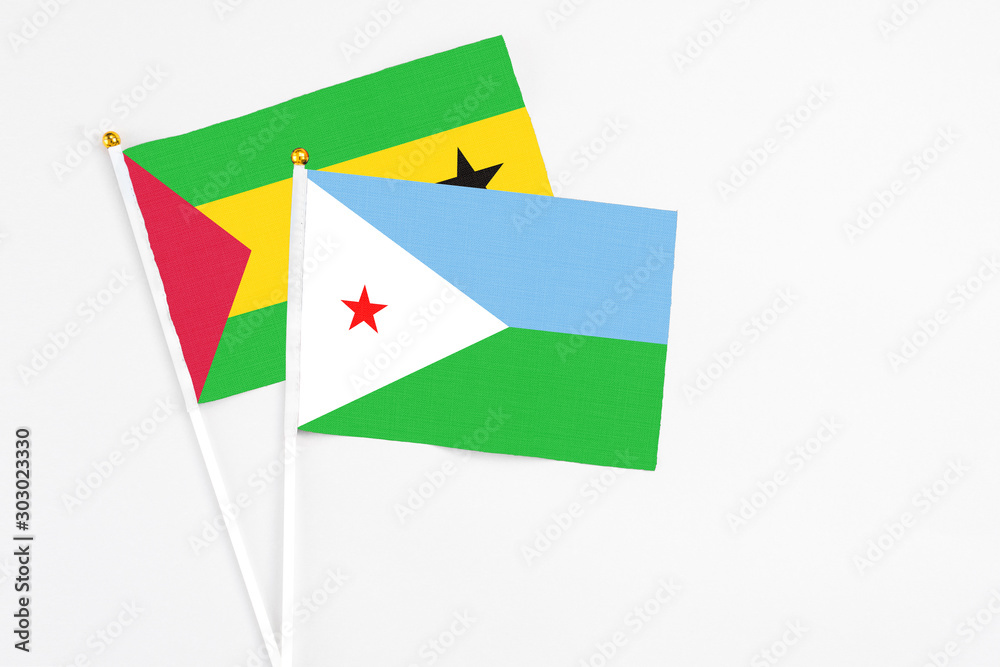 Djibouti and Sao Tome And Principe stick flags on white background. High quality fabric, miniature national flag. Peaceful global concept.White floor for copy space. Djibouti and Sao Tome And Principe stick flags on white background. High quality fabric, miniature national flag. Peaceful global concept.White floor for copy space.