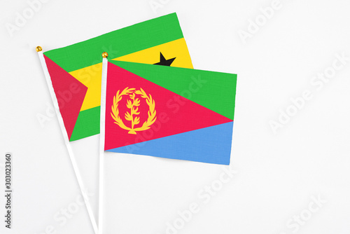 Free Download Eritrea and Sao Tome And Principe stick flags on white background. High quality fabric, miniature national flag. Peaceful global concept.White floor for copy space. - GFXLoad