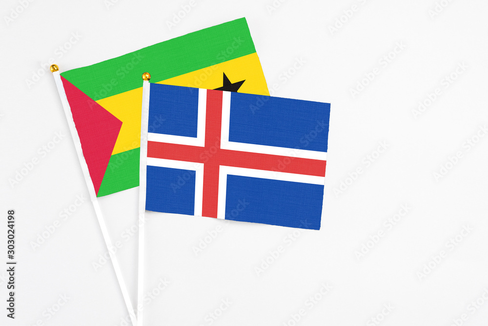 Iceland and Saudi Arabia stick flags on white background. High quality fabric, miniature national flag. Peaceful global concept.White floor for copy space. Iceland and Saudi Arabia stick flags on white background. High quality fabric, miniature national flag. Peaceful global concept.White floor for copy space.