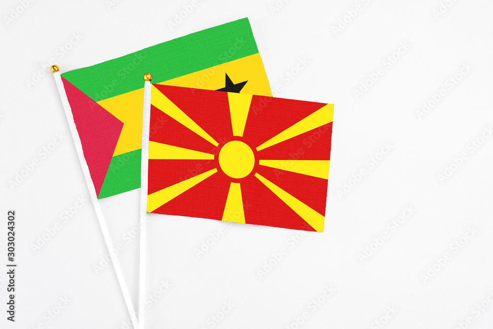 Macedonia and Saudi Arabia stick flags on white background. High quality fabric, miniature national flag. Peaceful global concept.White floor for copy space.