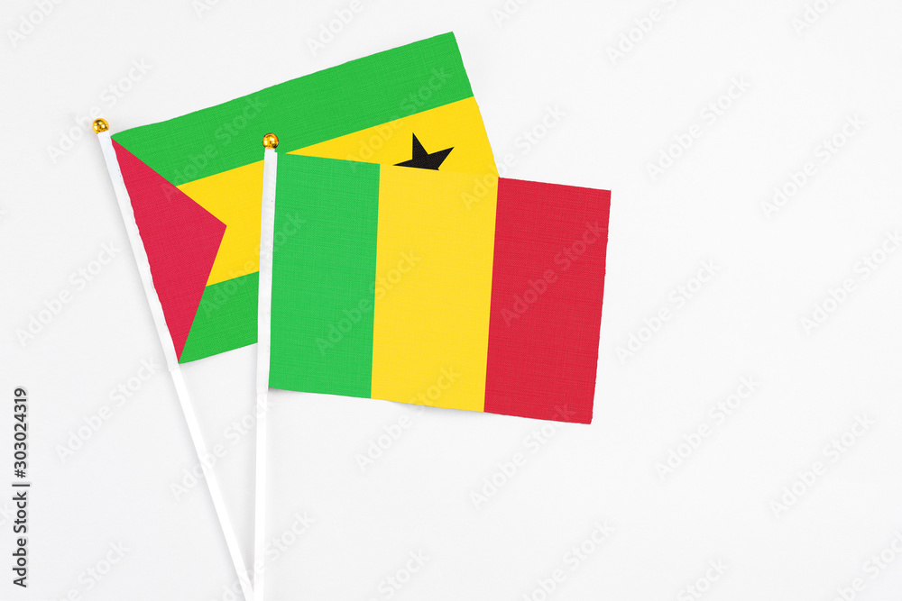 Mali and Saudi Arabia stick flags on white background. High quality fabric, miniature national flag. Peaceful global concept.White floor for copy space. Mali and Saudi Arabia stick flags on white background. High quality fabric, miniature national flag. Peaceful global concept.White floor for copy space.