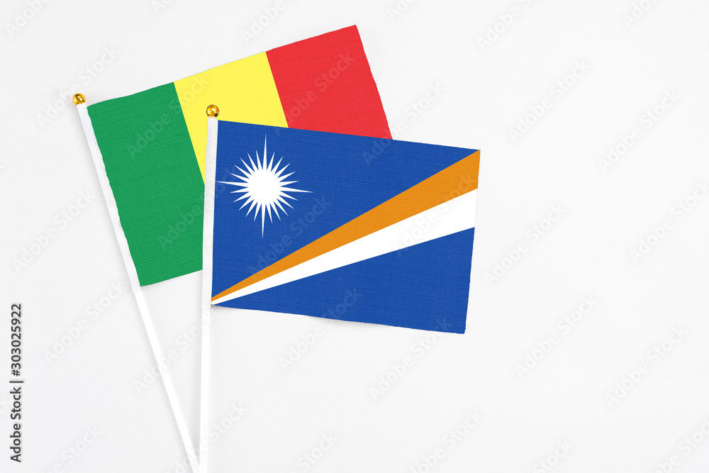 Marshall Islands and Senegal stick flags on white background. High quality fabric, miniature national flag. Peaceful global concept.White floor for copy space. Marshall Islands and Senegal stick flags on white background. High quality fabric, miniature national flag. Peaceful global concept.White floor for copy space.