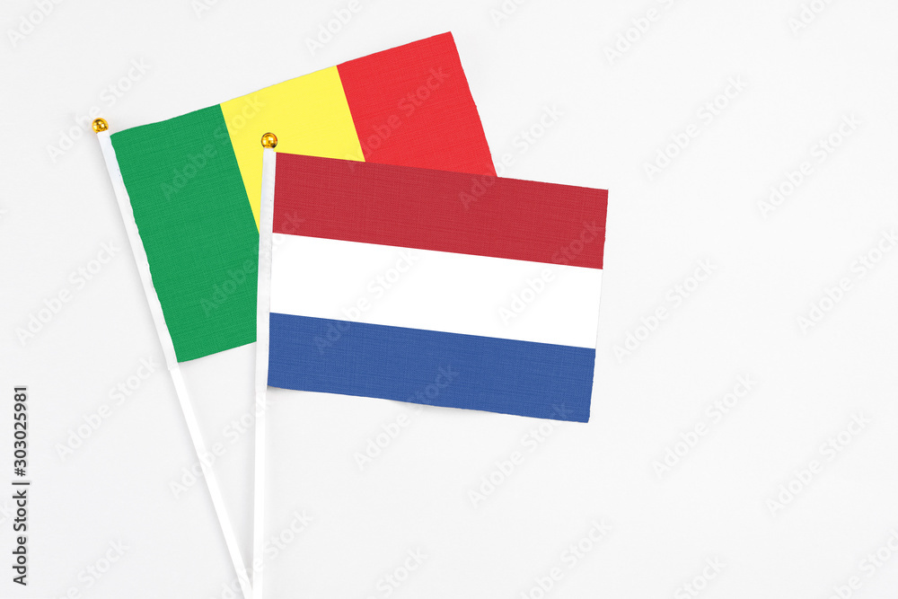 Netherlands and Senegal stick flags on white background. High quality fabric, miniature national flag. Peaceful global concept.White floor for copy space. Netherlands and Senegal stick flags on white background. High quality fabric, miniature national flag. Peaceful global concept.White floor for copy space.