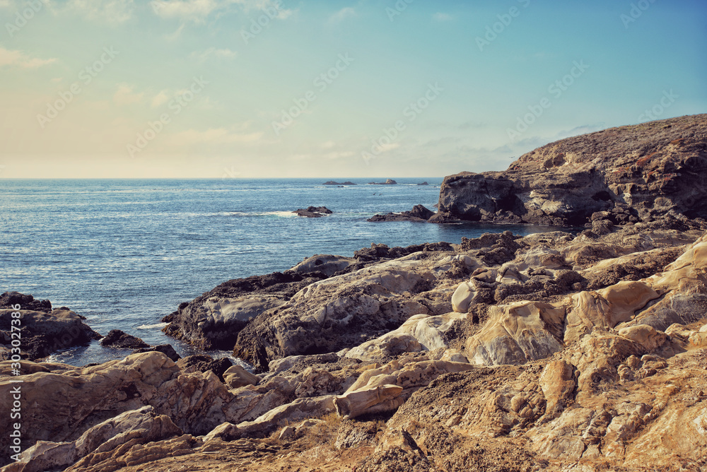 Large rocks on a wild pacific ocean coastline