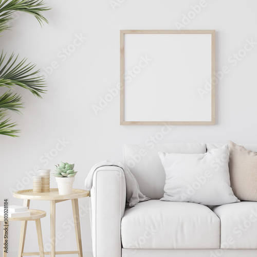 Fototapeta Naklejka Na Ścianę i Meble -  Square wooden frame mock up with sofa and green plants on white wall in living room. 3D illustration.