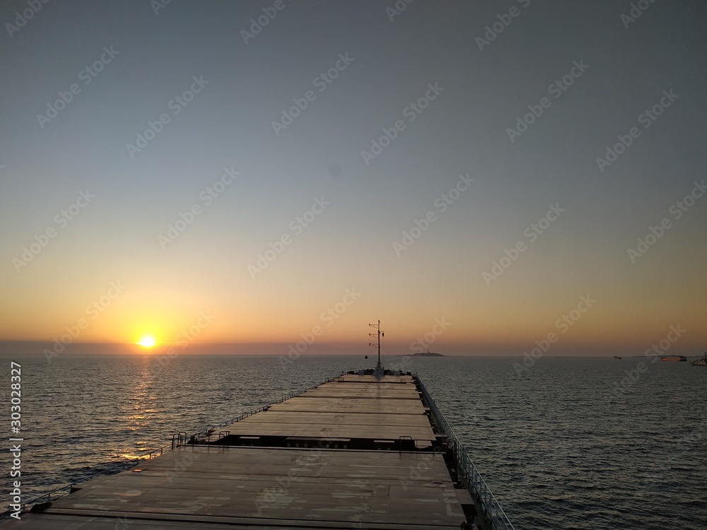 old wooden pier at sunset