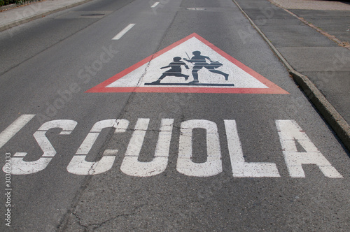 Attention children crossing for school sign drawn on the street © Marlon