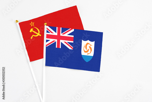 Anguilla and Soviet Union stick flags on white background. High quality fabric, miniature national flag. Peaceful global concept.White floor for copy space.