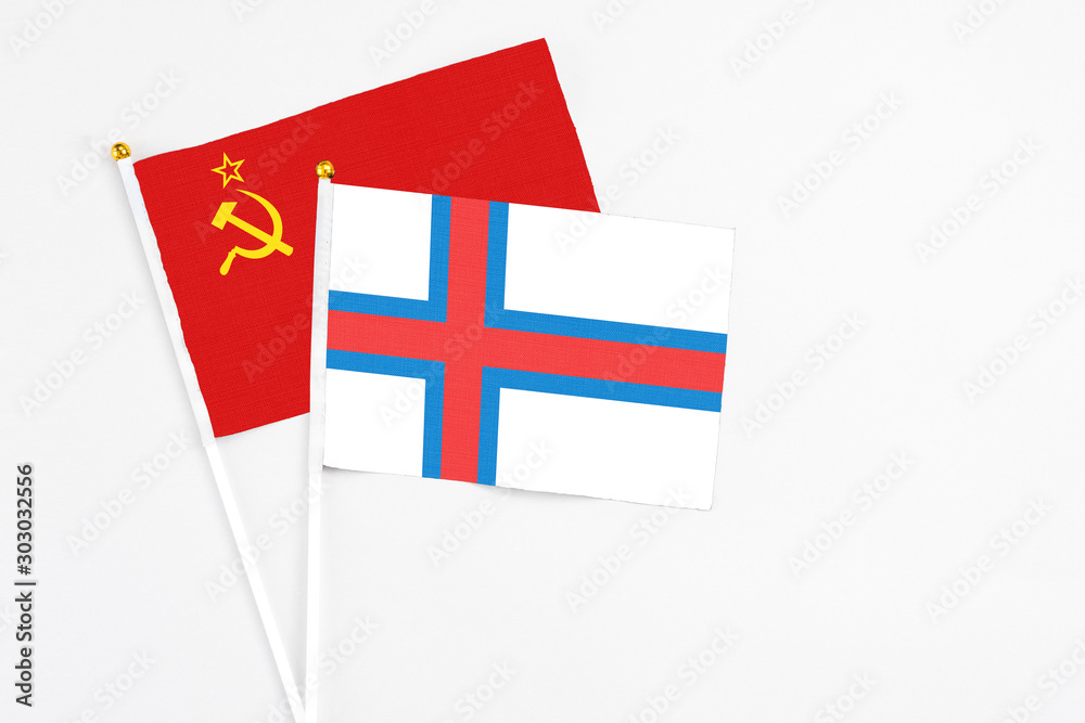 Faroe Islands and Soviet Union stick flags on white background. High quality fabric, miniature national flag. Peaceful global concept.White floor for copy space.
