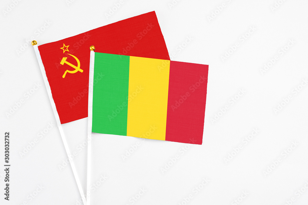 Mali and Soviet Union stick flags on white background. High quality fabric, miniature national flag. Peaceful global concept.White floor for copy space. Mali and Soviet Union stick flags on white background. High quality fabric, miniature national flag. Peaceful global concept.White floor for copy space.