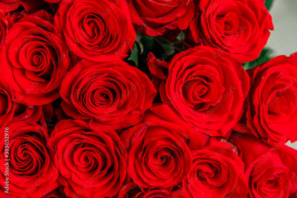 Cropped top-view photo of bouquet of big tender red roses. Cropped top-view photo of bouquet of big tender red roses.