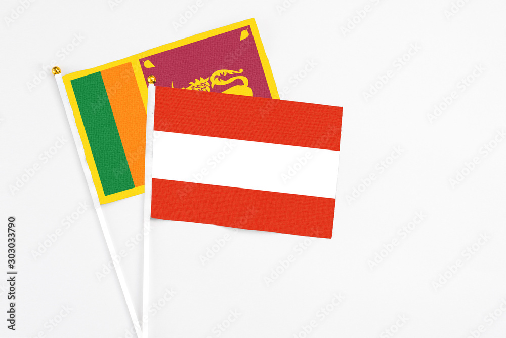 and Sri Lanka stick flags on white background. High quality fabric, miniature national flag. Peaceful global concept.White floor for copy space. and Sri Lanka stick flags on white background. High quality fabric, miniature national flag. Peaceful global concept.White floor for copy space.