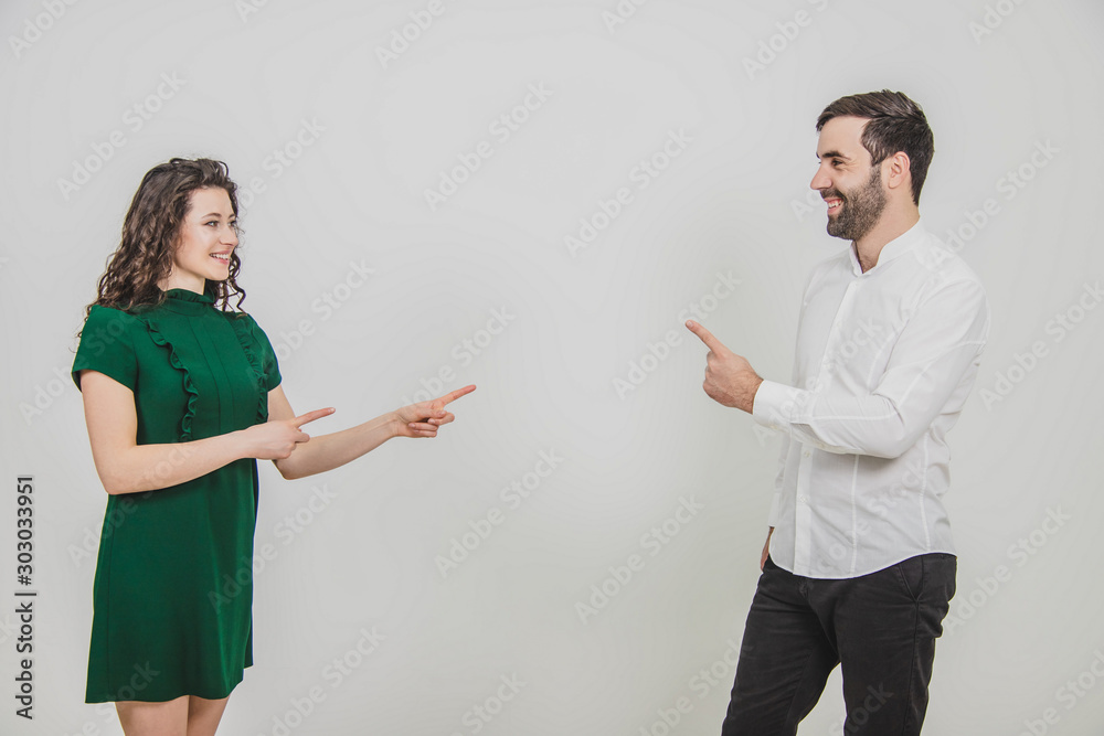 Businesspartners, man and woman, present a project to clients, with confidence and joy on face. Businesspartners, man and woman, present a project to clients, with confidence and joy on face.