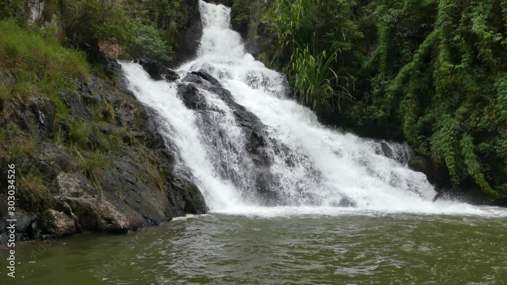 Datanla waterfall in DaLat, Vietnam. Waterfall ends in the lake. Close view of waterfall and rivier. Waterfall in the forest. Datanla waterfall in DaLat, Vietnam. Waterfall ends in the lake. Close view of waterfall and rivier. Waterfall in the forest.