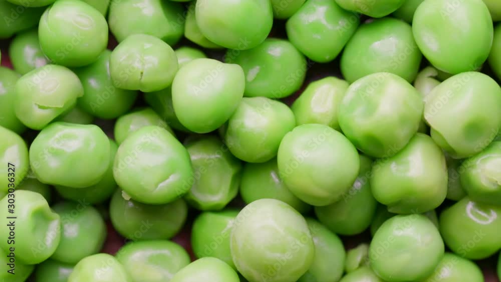 Close up of raw green peas rotating in а circle Close up of raw green peas rotating in а circle