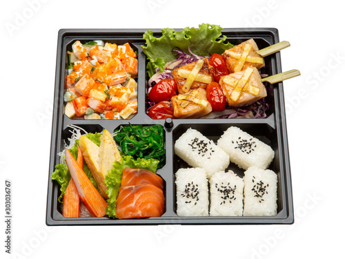Bento set with Sushi,BBQ Salmon,Crab stick Salad,Seaweed on the black tray isolated on white background.