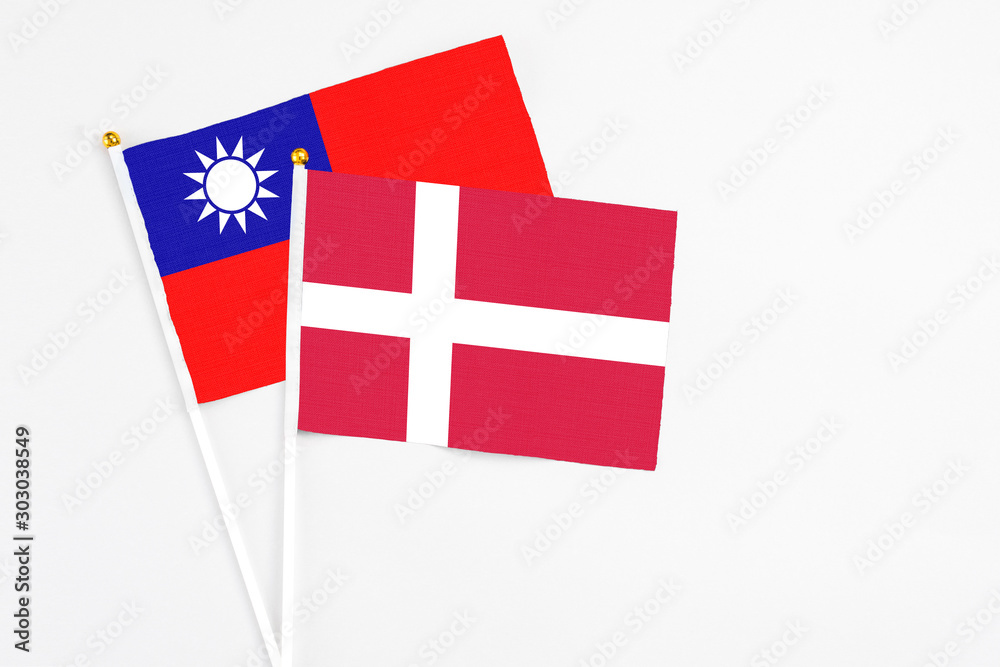 Denmark and Taiwan stick flags on white background. High quality fabric, miniature national flag. Peaceful global concept.White floor for copy space.