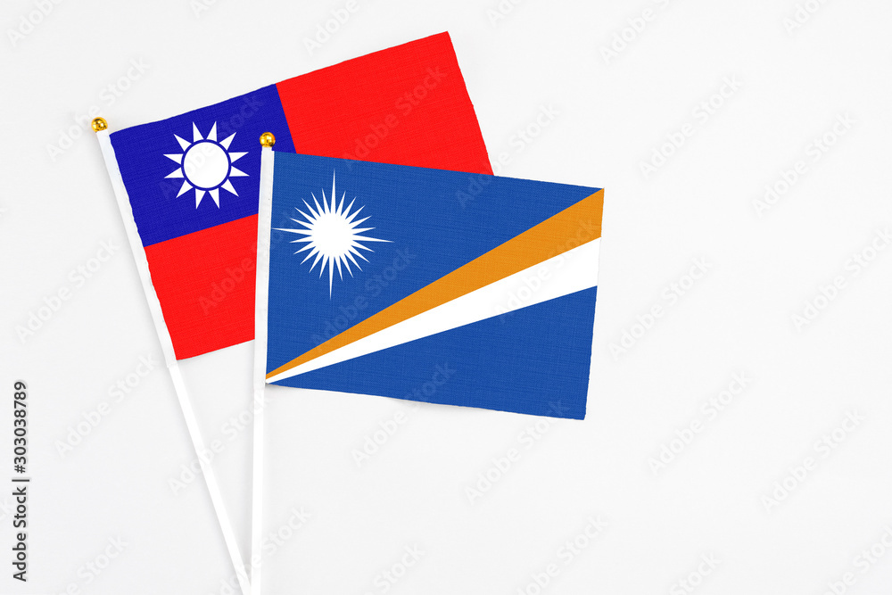 Marshall Islands and Taiwan stick flags on white background. High quality fabric, miniature national flag. Peaceful global concept.White floor for copy space. Marshall Islands and Taiwan stick flags on white background. High quality fabric, miniature national flag. Peaceful global concept.White floor for copy space.
