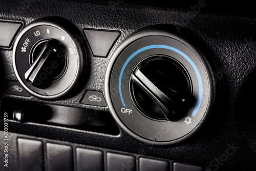 Air conditioner button for temperature climate adjustment in a car. © BLKstudio