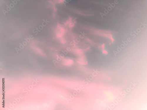 Abstract pink and gray sky background.