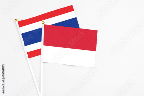 Free Download Monaco and Thailand stick flags on white background. High quality fabric, miniature national flag. Peaceful global concept.White floor for copy space. - GFXLoad