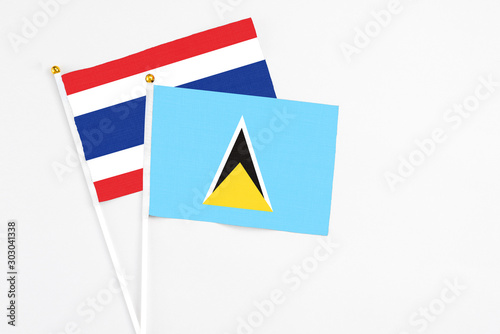 Saint Lucia and Thailand stick flags on white background. High quality fabric, miniature national flag. Peaceful global concept.White floor for copy space. Free Download Saint Lucia and Thailand stick flags on white background. High quality fabric, miniature national flag. Peaceful global concept.White floor for copy space. - GFXLoad