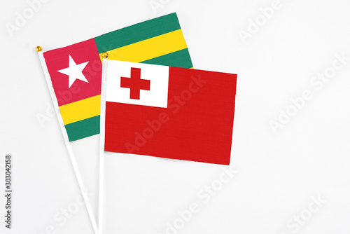 Tonga and Togo stick flags on white background. High quality fabric, miniature national flag. Peaceful global concept.White floor for copy space. Free Download Tonga and Togo stick flags on white background. High quality fabric, miniature national flag. Peaceful global concept.White floor for copy space. - GFXLoad