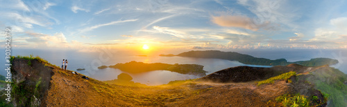 Sunrise panorama from Gunung Api volcano, overlooking Banda Neira island, Maluku. Banda is the famous hub of Indonesia's Spice Islands, once traded for Manhattan for access to lucrative nutmeg crops