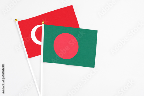 Free Download Bangladesh and Turkey stick flags on white background. High quality fabric, miniature national flag. Peaceful global concept.White floor for copy space. - GFXLoad