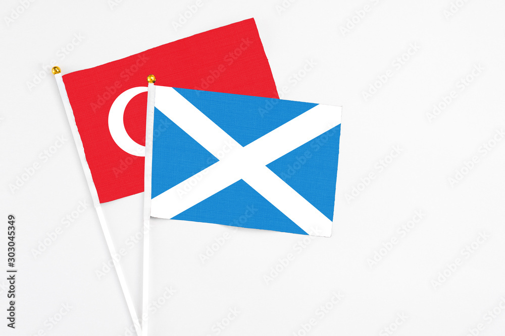 Scotland and Turkey stick flags on white background. High quality fabric, miniature national flag. Peaceful global concept.White floor for copy space. Scotland and Turkey stick flags on white background. High quality fabric, miniature national flag. Peaceful global concept.White floor for copy space.