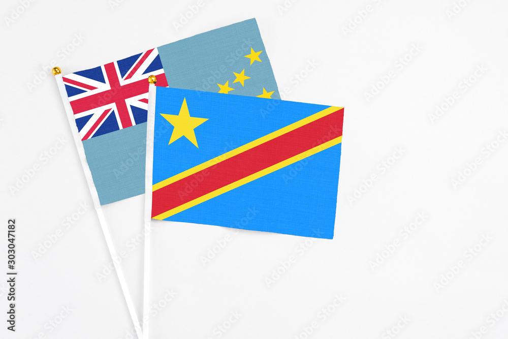 Congo and Tuvalu stick flags on white background. High quality fabric, miniature national flag. Peaceful global concept.White floor for copy space. Congo and Tuvalu stick flags on white background. High quality fabric, miniature national flag. Peaceful global concept.White floor for copy space.
