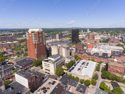 Manchester downtown building including City Hall Plaza and Brady Sullivan Plaza with Merrimack River at the background aerial view, Manchester, New Hampshire, NH, USA. photo