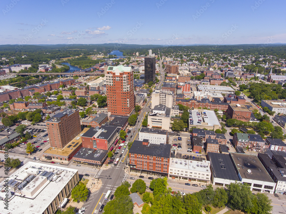 Fototapeta Manchester downtown building including City Hall Plaza and Brady Sullivan Plaza with Merrimack River at the background aerial view, Manchester, New Hampshire, NH, USA.