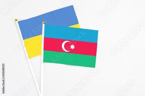 Azerbaijan and Ukraine stick flags on white background. High quality fabric, miniature national flag. Peaceful global concept.White floor for copy space. Free Download Azerbaijan and Ukraine stick flags on white background. High quality fabric, miniature national flag. Peaceful global concept.White floor for copy space. - GFXLoad