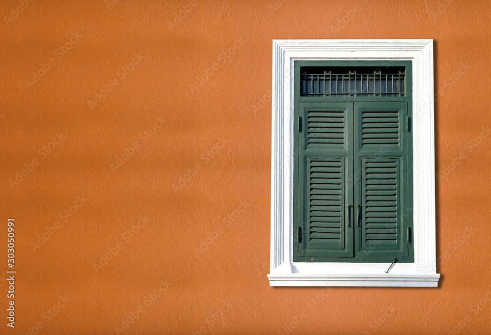 Traditional windows on bright red walls