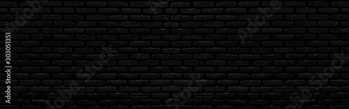 Abstract black brick wall texture for background or wallpaper design. panorama picture.