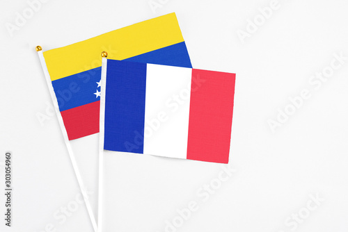 Free Download France and Venezuela stick flags on white background. High quality fabric, miniature national flag. Peaceful global concept.White floor for copy space. - GFXLoad