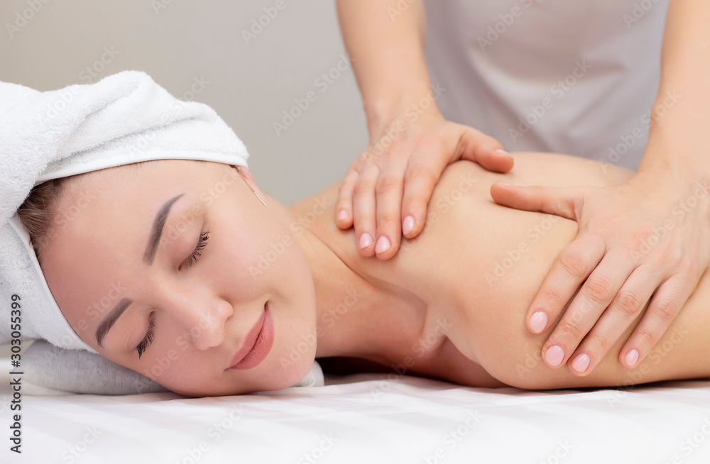 Massage and body care. Spa body massage woman hands treatment. Woman having massage in the spa salon for beautiful girl Massage and body care. Spa body massage woman hands treatment. Woman having massage in the spa salon for beautiful girl