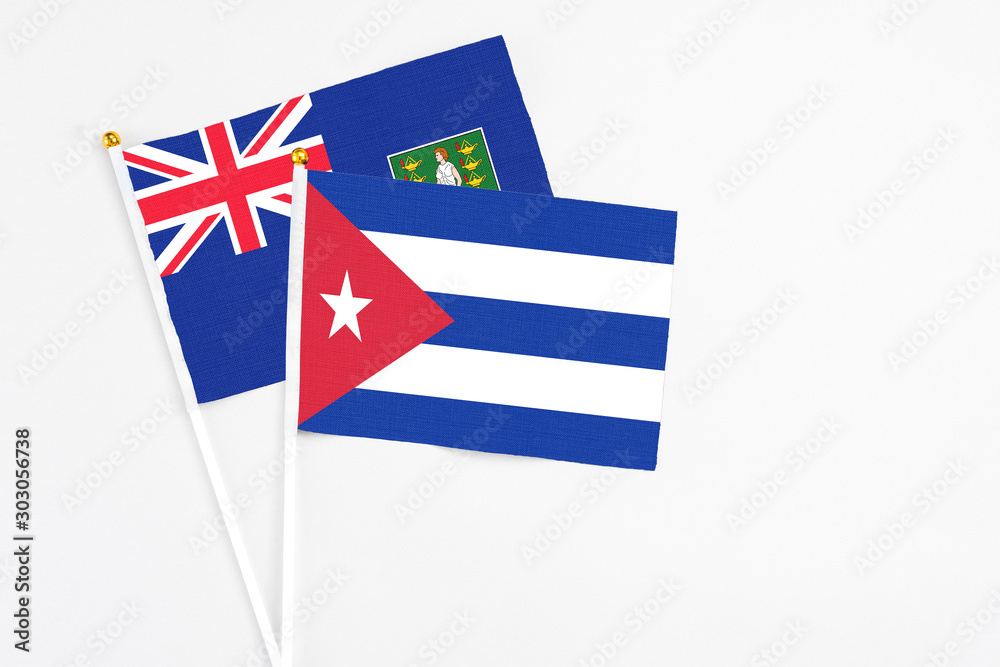 Cuba and British Virgin Islands stick flags on white background. High quality fabric, miniature national flag. Peaceful global concept.White floor for copy space. Cuba and British Virgin Islands stick flags on white background. High quality fabric, miniature national flag. Peaceful global concept.White floor for copy space.