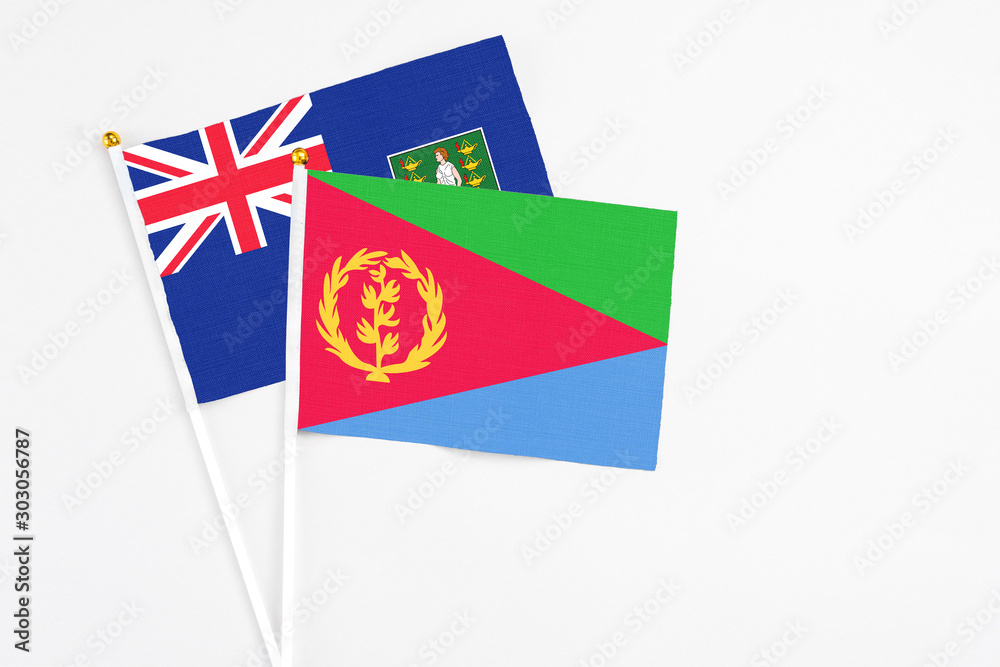 Eritrea and British Virgin Islands stick flags on white background. High quality fabric, miniature national flag. Peaceful global concept.White floor for copy space. Eritrea and British Virgin Islands stick flags on white background. High quality fabric, miniature national flag. Peaceful global concept.White floor for copy space.