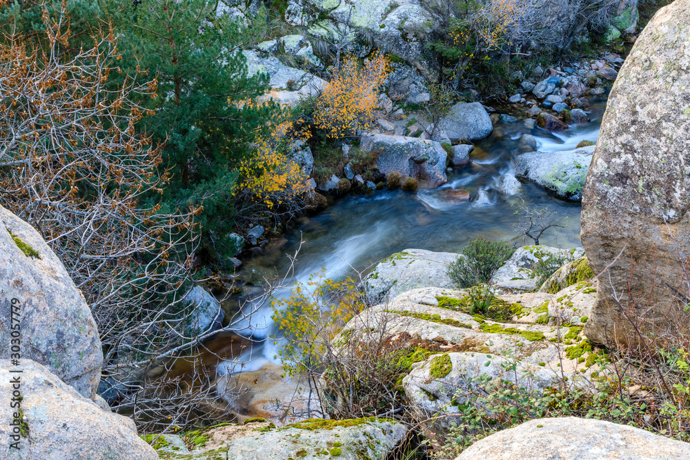 River in La Pedriza, in the mountains of Madrid, area characterized by large granite rocks River in La Pedriza, in the mountains of Madrid, area characterized by large granite rocks