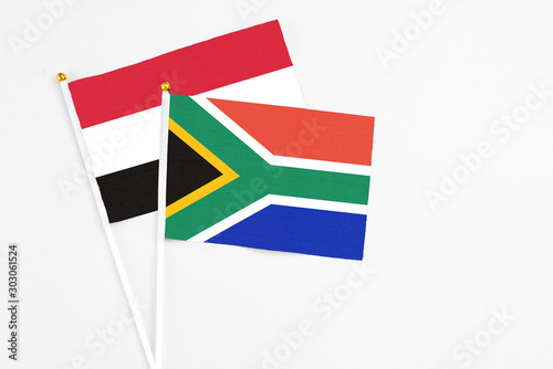 Free Download South Africa and Yemen stick flags on white background. High quality fabric, miniature national flag. Peaceful global concept.White floor for copy space. - GFXLoad