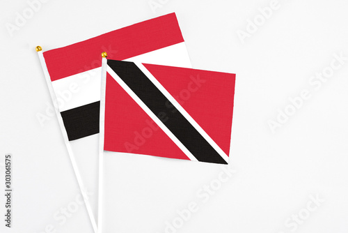 Free Download Trinidad And Tobago and Yemen stick flags on white background. High quality fabric, miniature national flag. Peaceful global concept.White floor for copy space. - GFXLoad