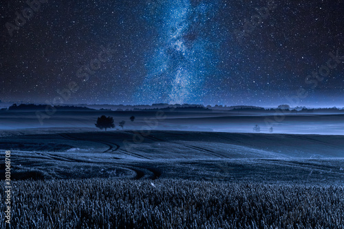 Milky way over filed with o...