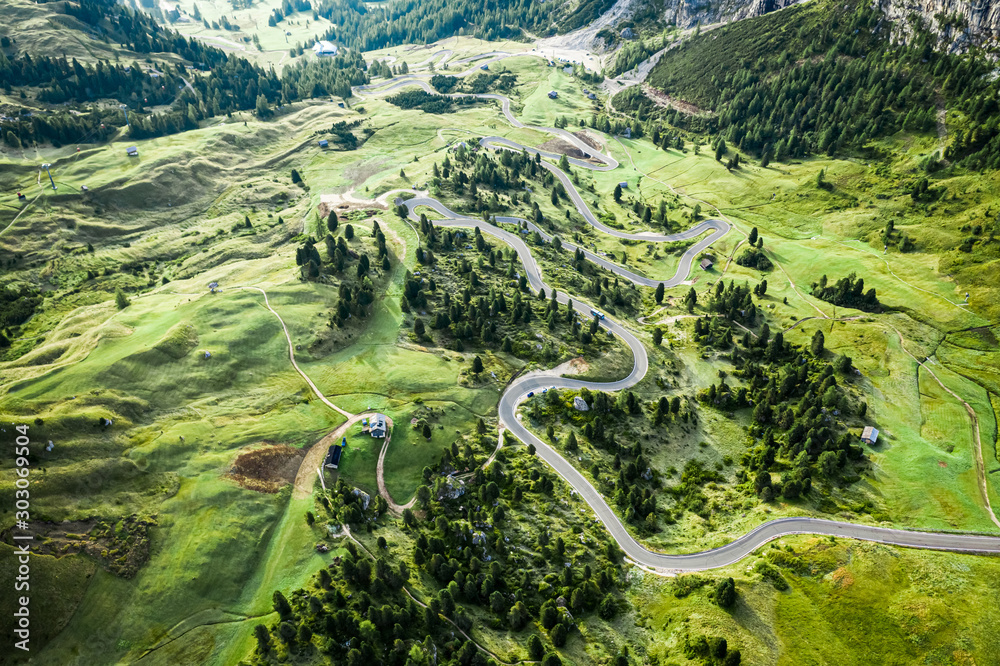 Aerial view of serpentine leading to Passo Gardena, Dolomites - obrazy, fototapety, plakaty 