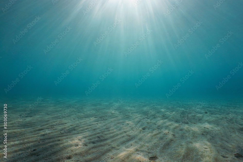 Sand underwater on the seabed with sunlight, natural scene, Mediterranean sea